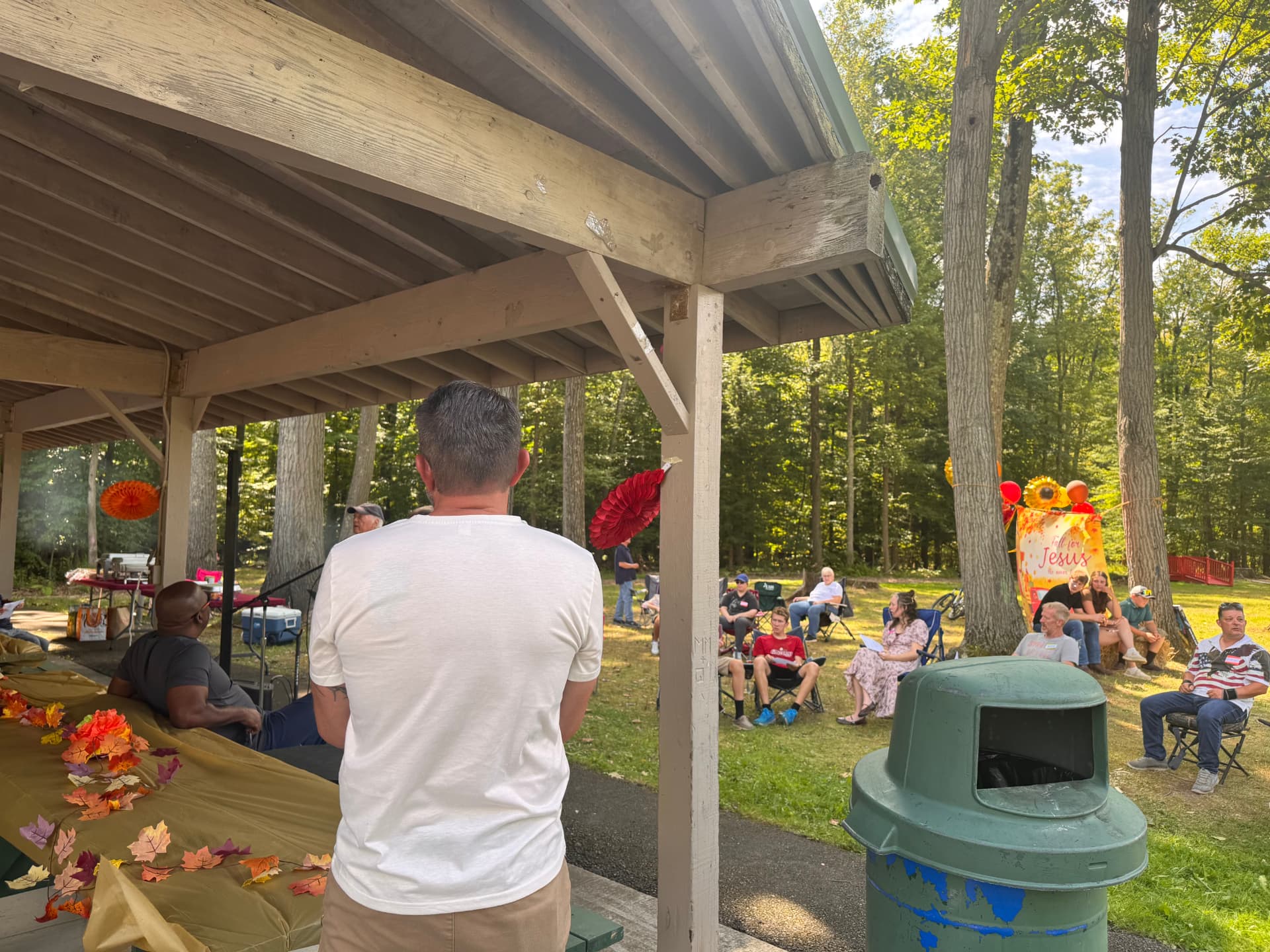 Attendees listening during the picnic gathering