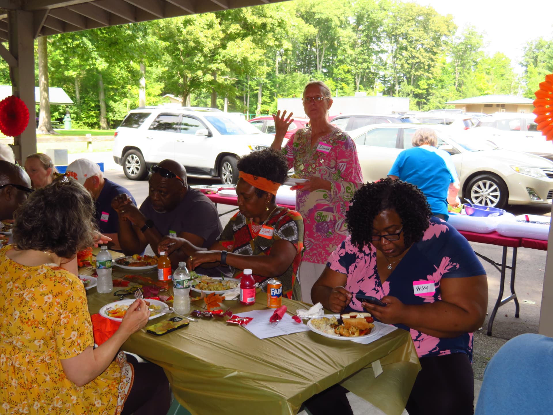 Members sharing a meal and conversation at the pavilion